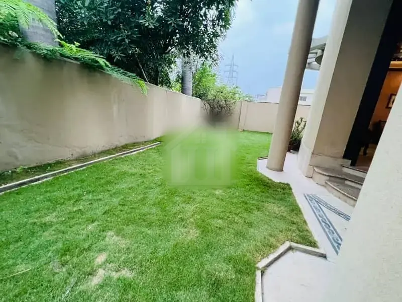 1 Kanal Single Story House With Beautiful Lawn. At Investor Price