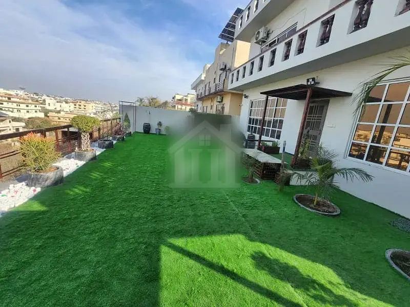 30 Marla Fully Furnished House with Big Lawn.